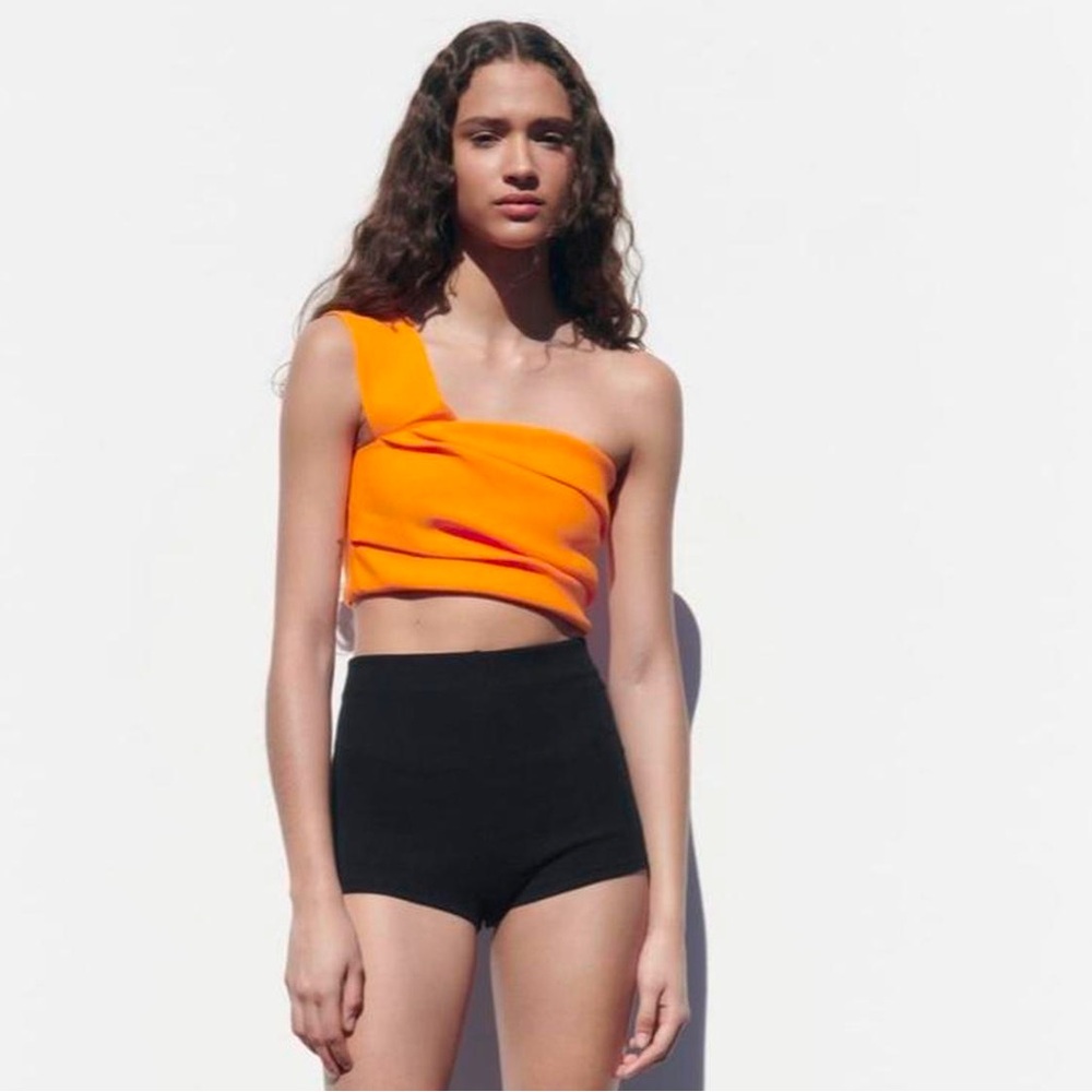 Worn once ZARA asymmetrical orange crop top. Size medium.